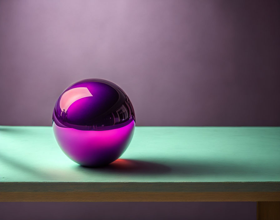 Shiny purple sphere on wooden surface with colorful lighting