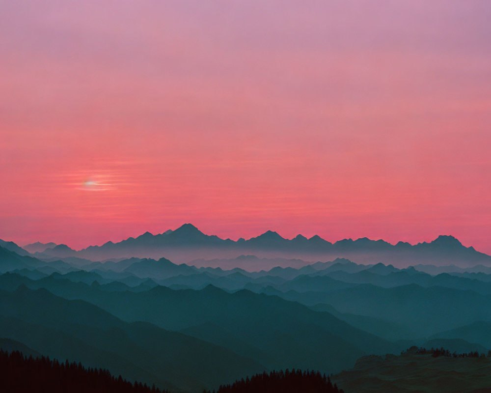 Mountain Silhouettes Under Pink and Orange Sunset Sky