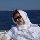 Woman with White Scarf in Artistic Ocean Background
