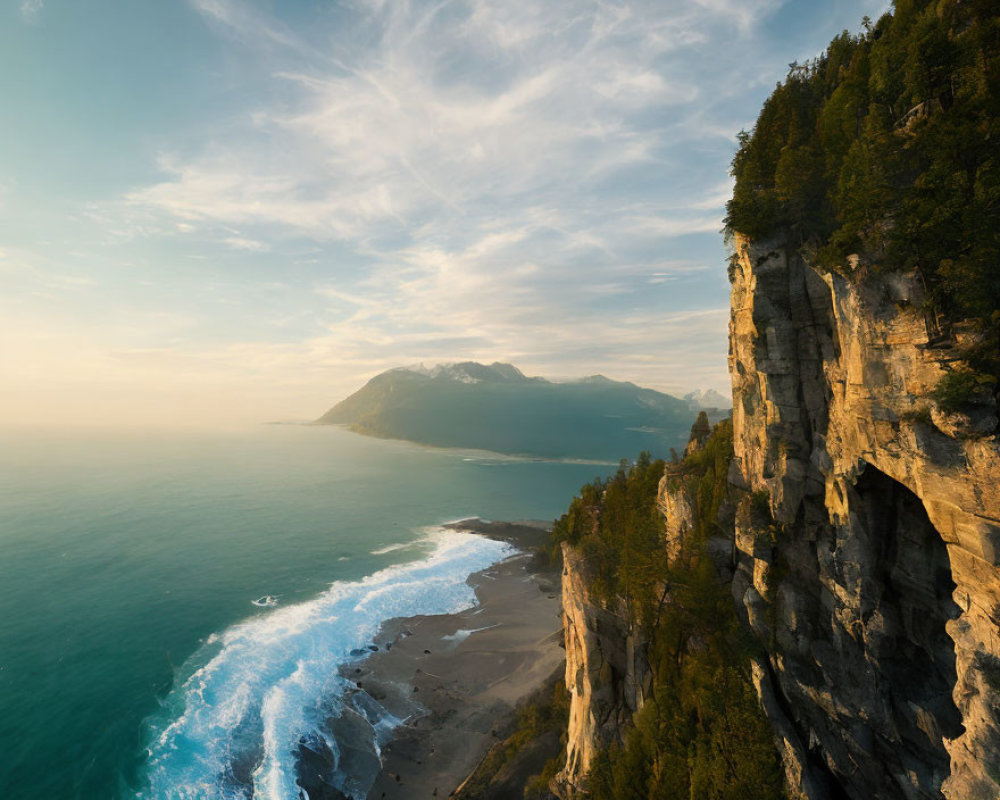 Tranquil coastal sunset scene with rugged cliff and misty beach