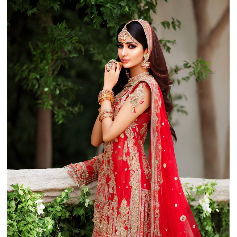 Elegant Woman in Red Lehenga with Traditional Jewelry