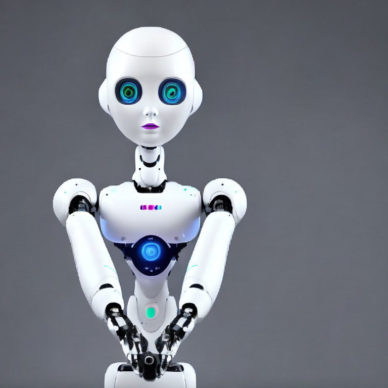 White humanoid robot with blue eyes and black details against grey backdrop