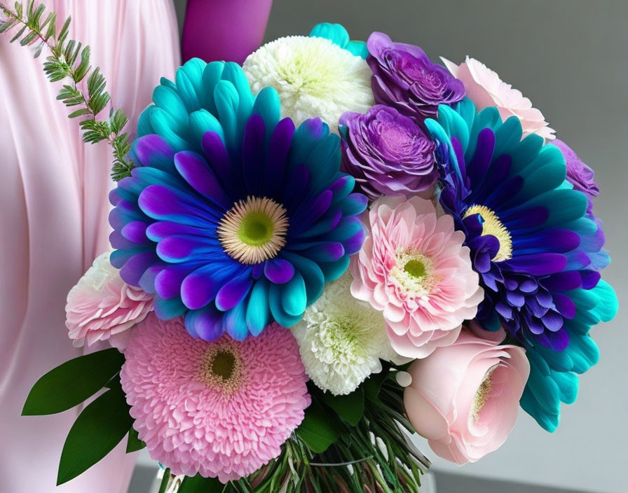 Colorful Bouquet of Blue, Purple, Pink, and White Flowers on Pink Fabric