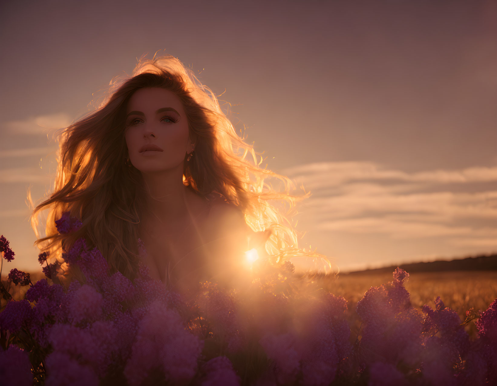 Woman in Flower Field at Sunset with Illuminated Hair