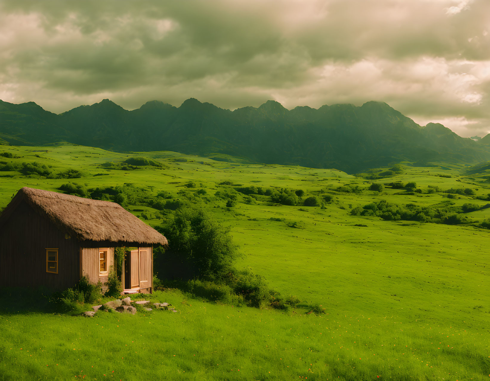 Rustic wooden cabin in green meadow with rolling hills & mountain range under cloudy sky