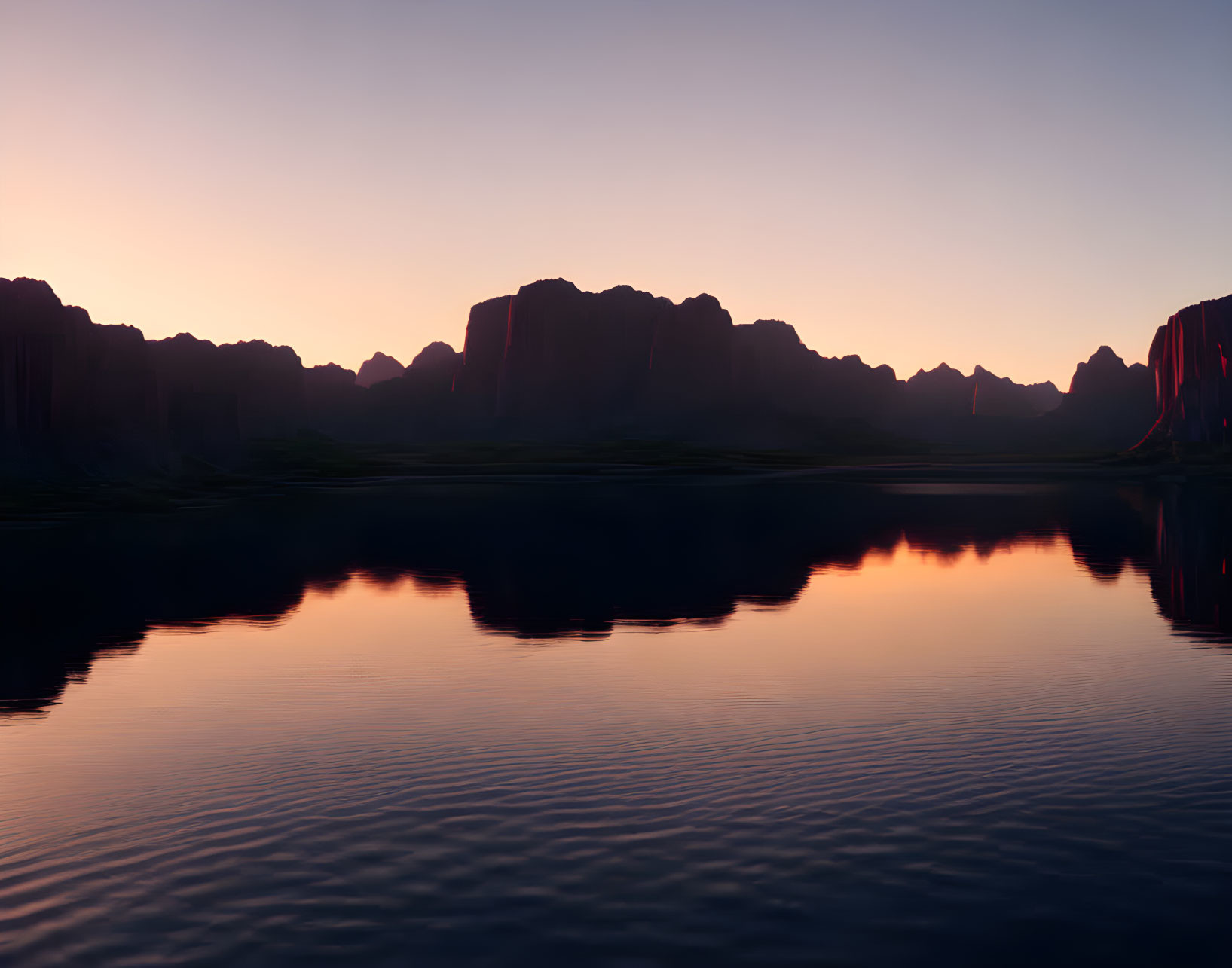Tranquil sunrise over lake with mountain silhouettes