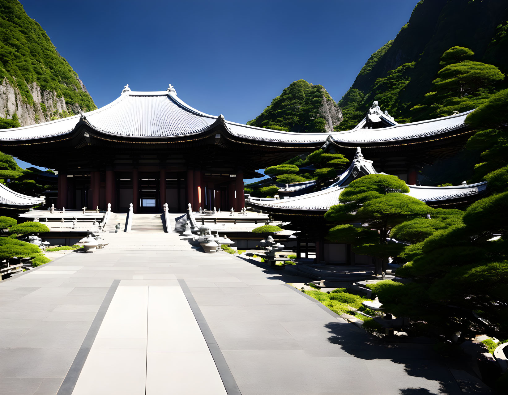 Japanese Temple Surrounded by Greenery and Mountains