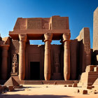 Massive columns and ornate carvings in an Ancient Egyptian temple