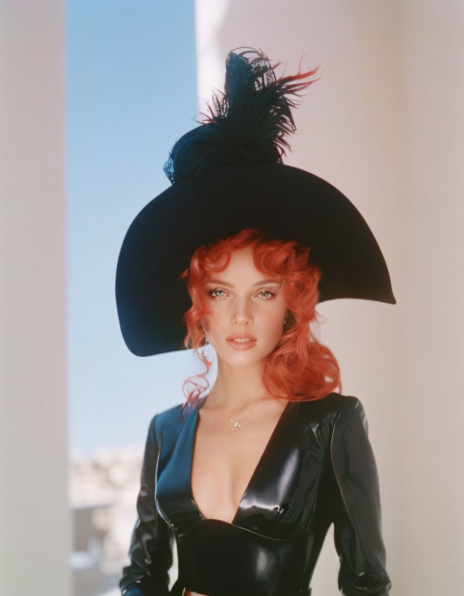 Red-haired woman in curled hairstyle wearing black hat and leather outfit on soft background