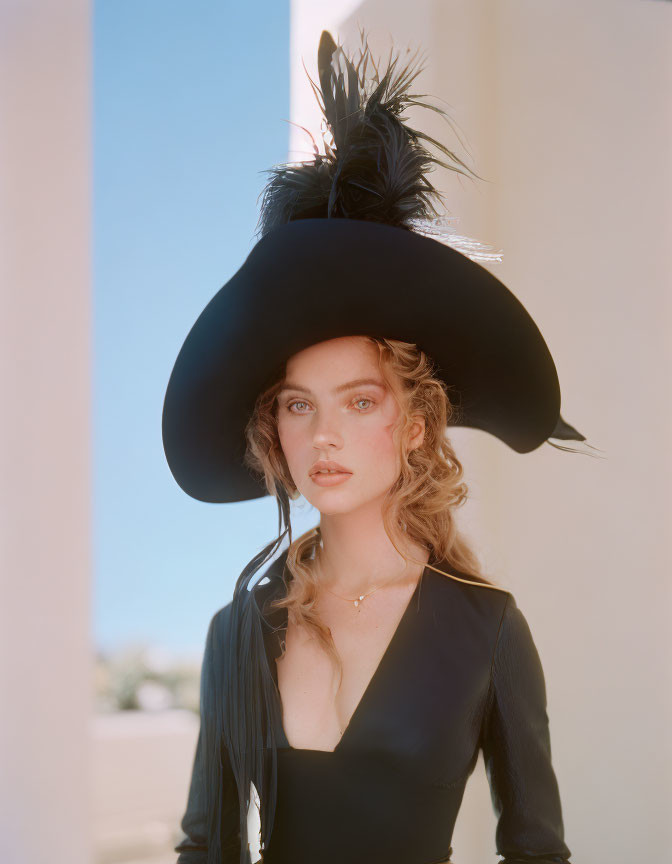 Woman with Wavy Hair in Black Feathered Hat and V-Neck Blouse