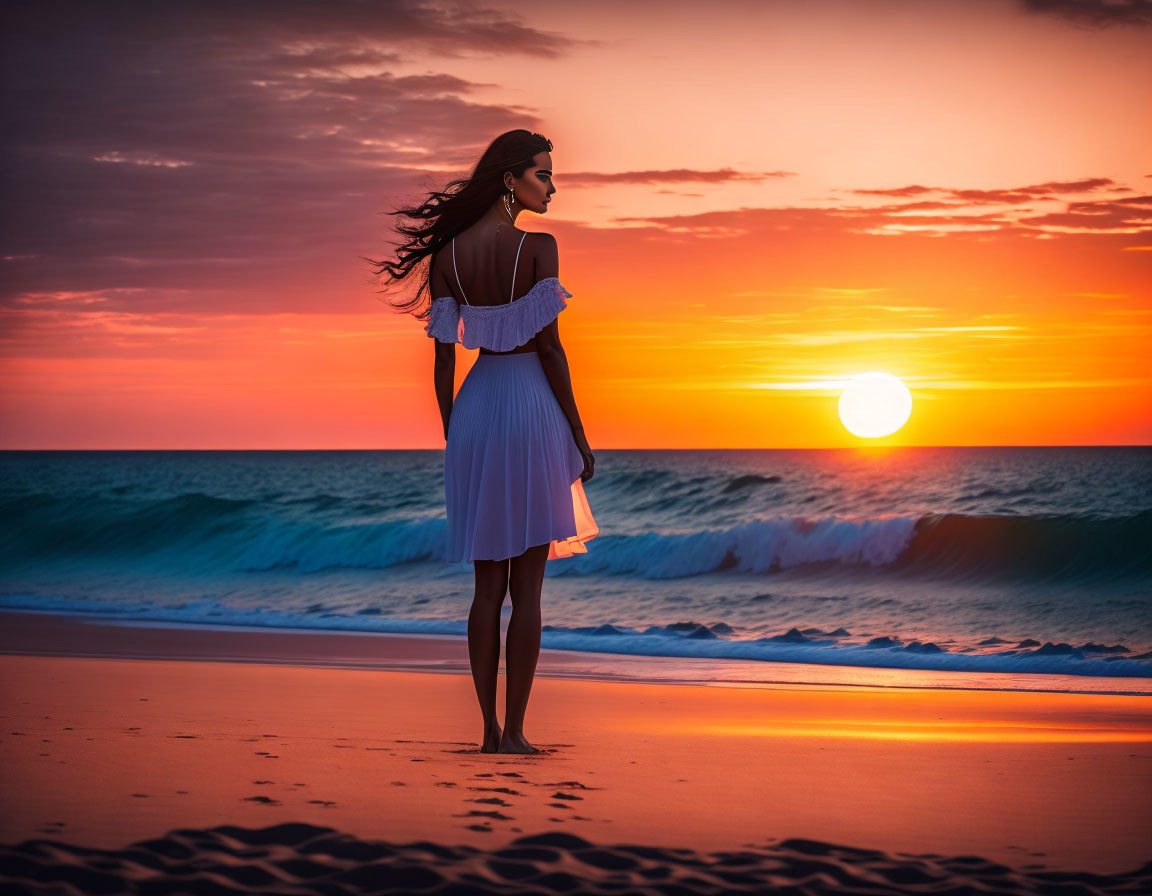 Woman in white dress on beach at sunset, watching sun meet sea