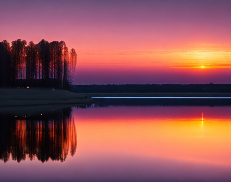 Tranquil Sunset Scene with Purple and Orange Hues Reflecting on Lake