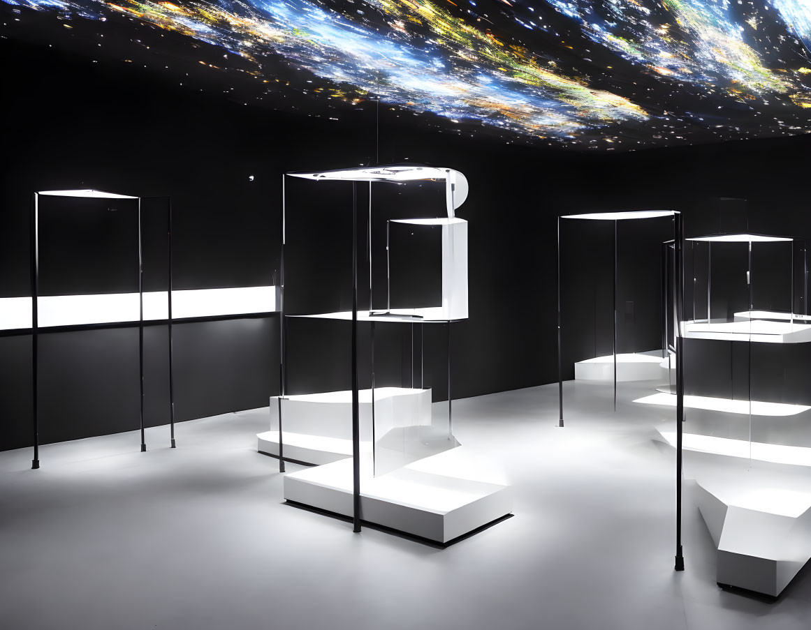 Contemporary exhibition space with glass display cases, white platforms, and cosmic wallpaper.