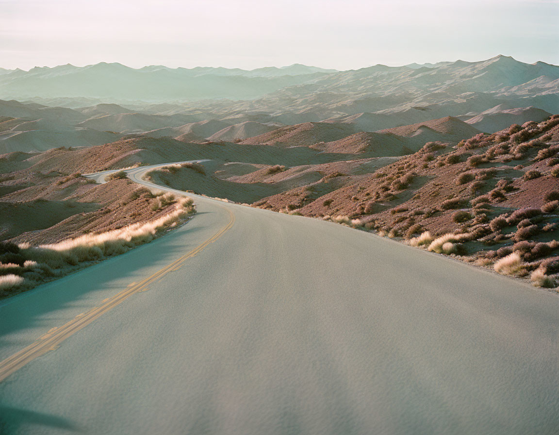 Winding Road Through Hilly Desert Landscape