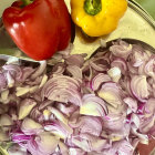 Vibrant Chopped Vegetables with Yellow Flower Garnish