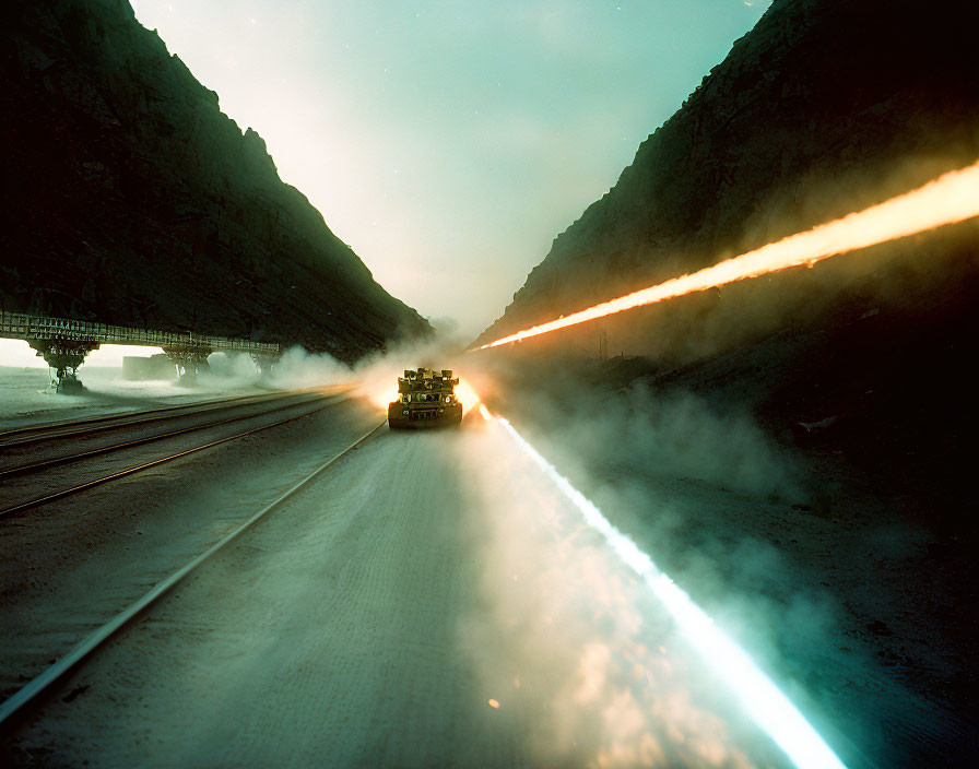 Military tank firing on misty mountain road at twilight