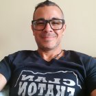 Gray-Haired Man in Black Glasses and "FREELANCER" T-Shirt Illustration