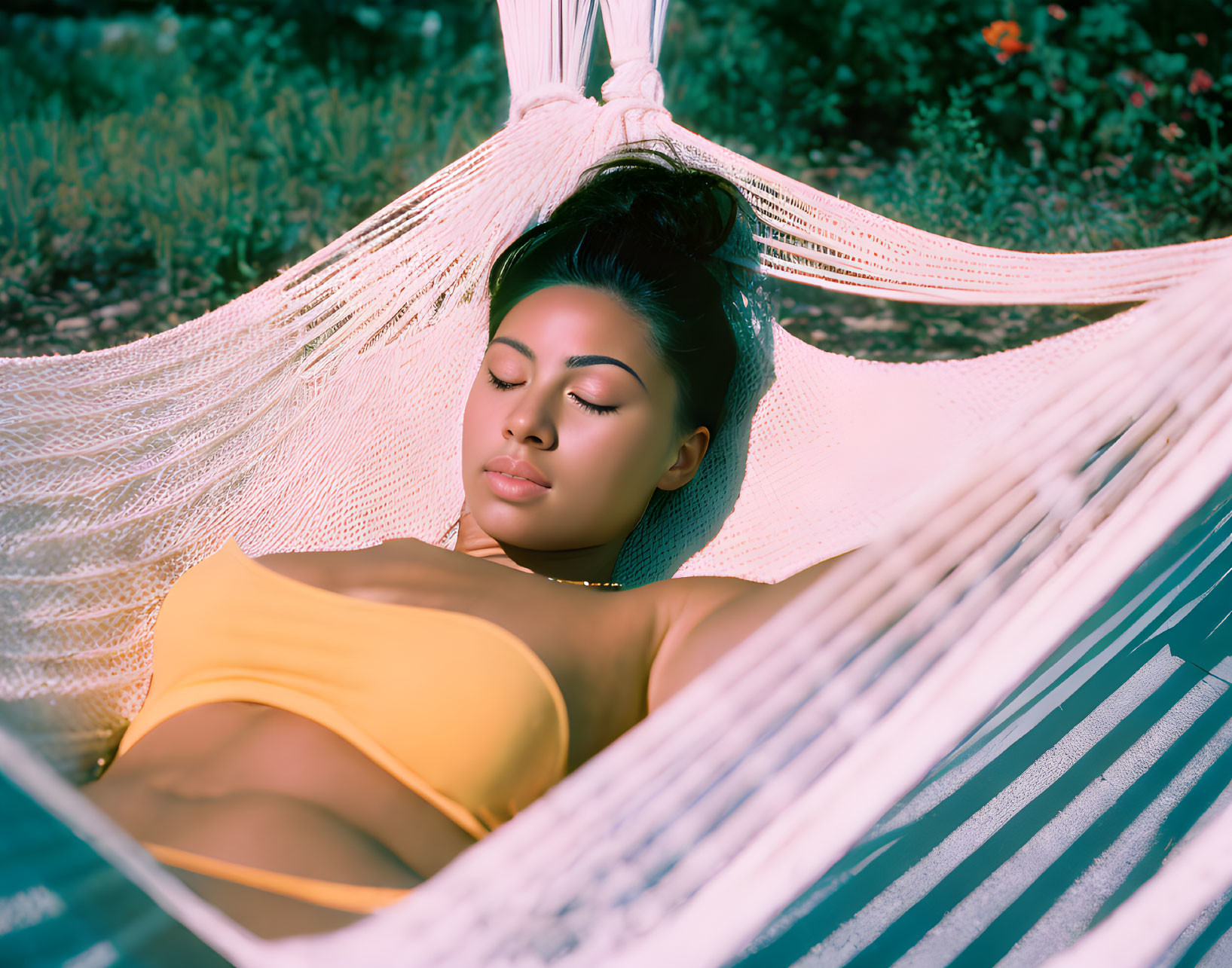 Woman in Yellow Top Relaxing in White Hammock Outdoors