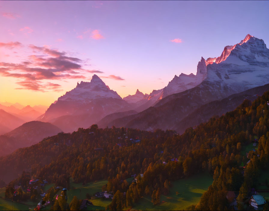 Snow-capped peaks and vibrant skies in alpine landscape at sunset