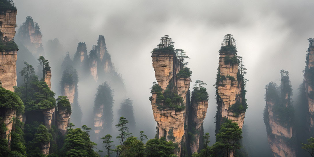 Mist-covered sandstone pillars in Zhangjiajie National Forest Park