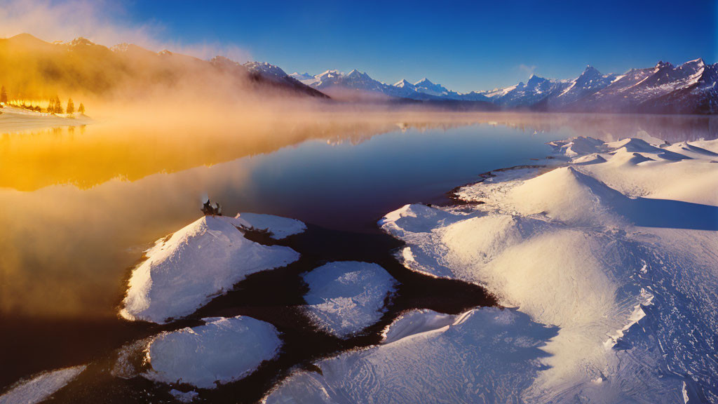 Serene winter landscape with misty river, snow-covered islets, glowing sunrise, and distant mountains