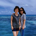Digital Artwork: Two Women by the Sea with Boats and Flying Fish