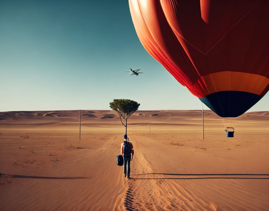Person walking towards hot air balloon in desert with lone tree and sand dunes, clear sky and distant