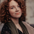 Striking Blue Eyes and Red Curly Hair in Dark Outfit and Green Scarf