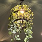 Elegant chandelier with vibrant flowers, greenery, and hummingbirds