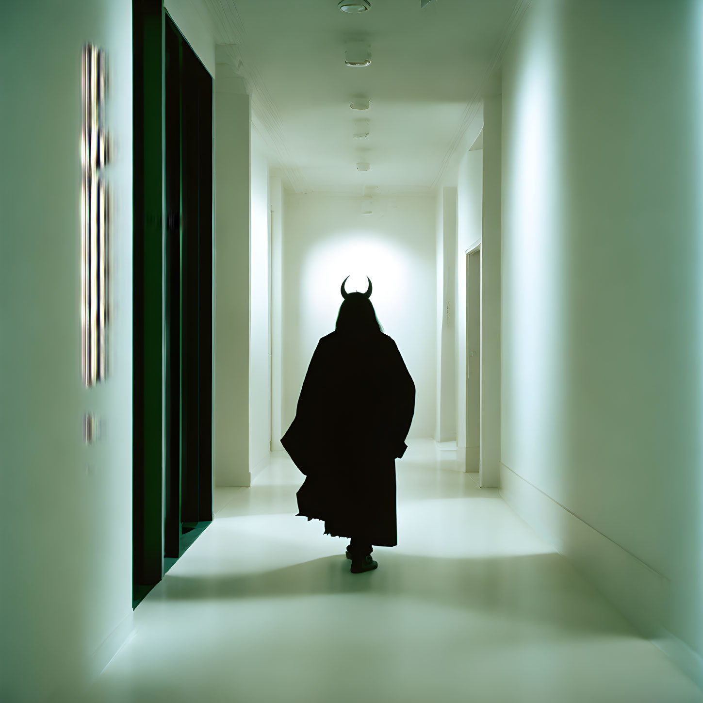 Dark cloaked figure with horns in modern hallway contrast light and shadow