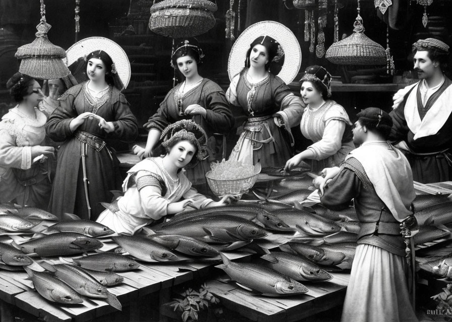 Women in traditional attire at fish market with abundant fish.