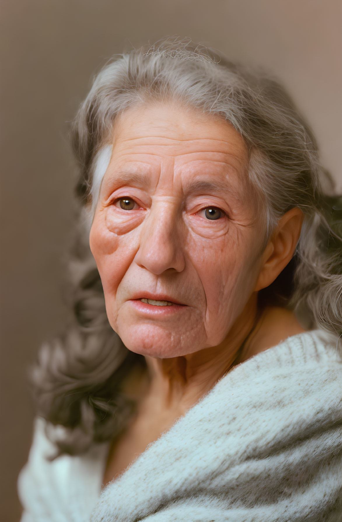 Elderly woman. Gray white hair.