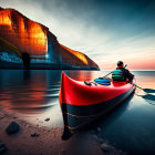 Red kayak on pebbly shore at dusk with person inside, facing towering cliffs