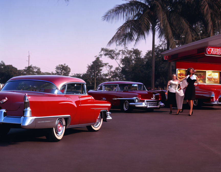 Vintage Red Cars and Women Waving in 1950s Drive-In Scene