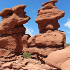 Desert landscape with red rock formations and blue sky