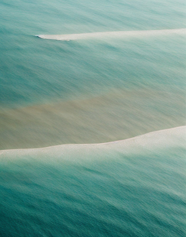 Tranquil Aerial View of Blue and Green Sea Waves