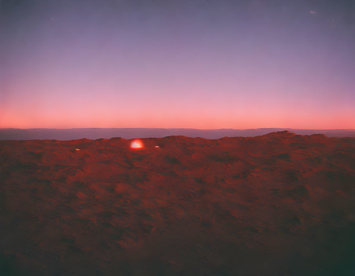 Twilight scene with crimson sunset over rugged rocky terrain