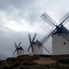 Traditional windmills in rural setting at dawn or dusk