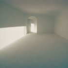 Minimalist Room with Sand-Filled Floor and Partially Open White Door