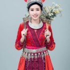 Traditional Ethnic Attire Woman with Elaborate Headdress and Flowers