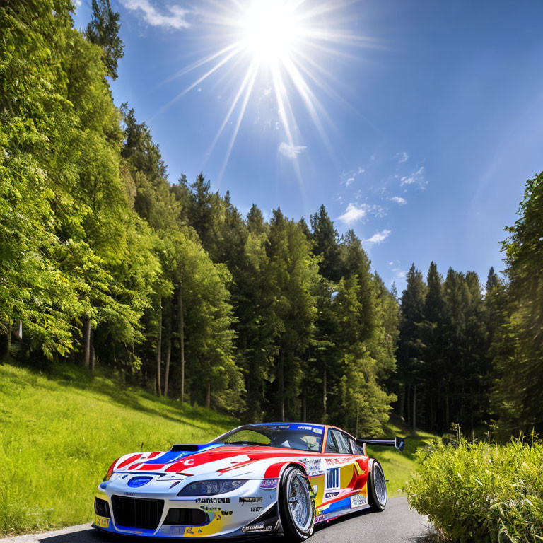 Vibrant livery race car on forest-lined road under bright sun