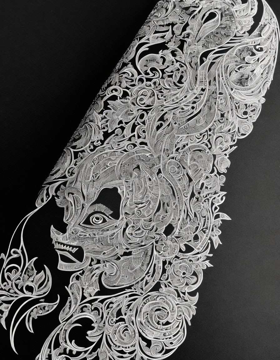 Detailed White Paper Cut-Out Artwork of Leaf/Feather Pattern on Black Background