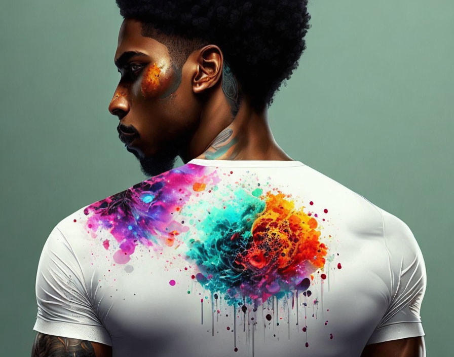 Stylish man with afro in colorful paint splatter shirt on teal background