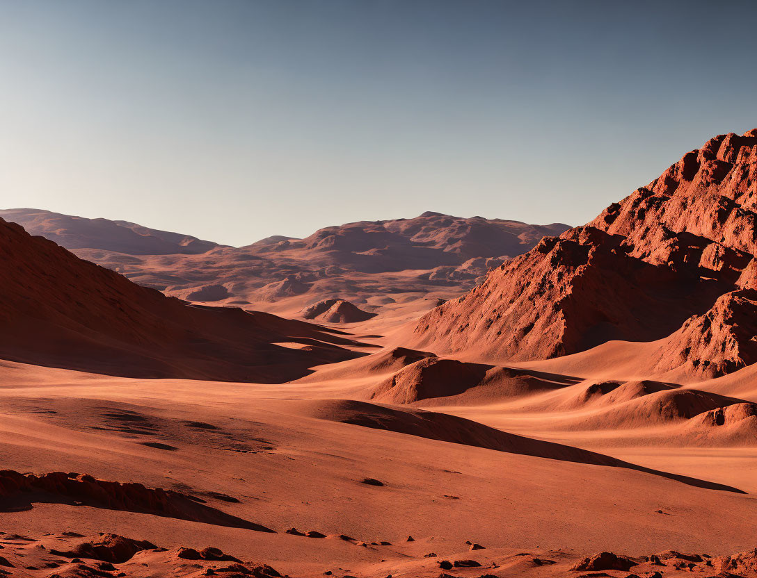 Desert landscape with sand dunes, cliffs, and clear sky