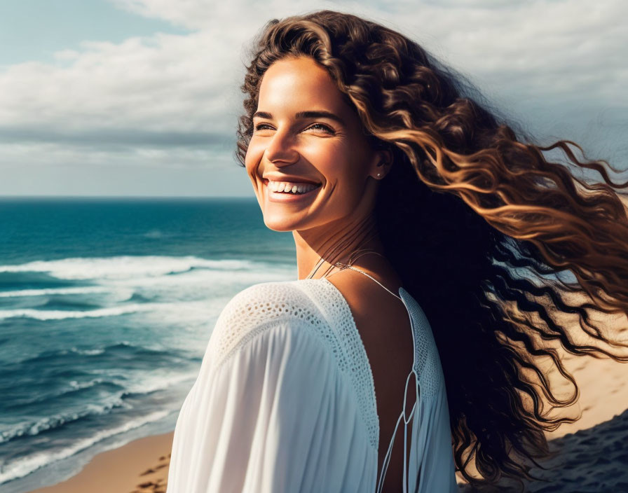 Curly-haired woman smiling at beach under sunlight