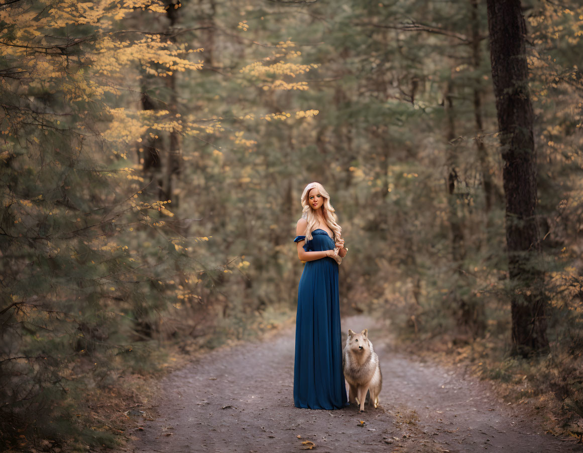 Woman in Blue Dress with Large Dog on Forest Path Amid Autumn Trees