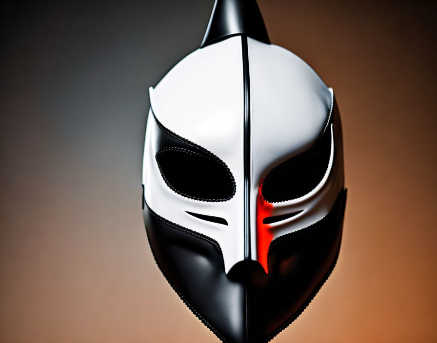 Futuristic Black and White Mask with Red Stripe on Blurred Amber Background
