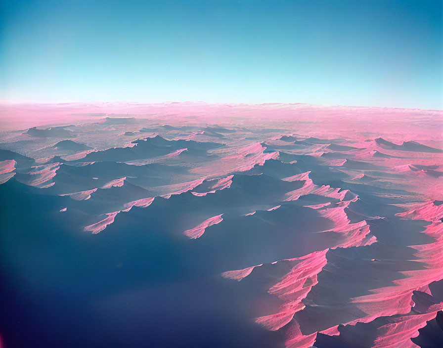 Surreal pink-tinted landscape with rolling hills and ridges