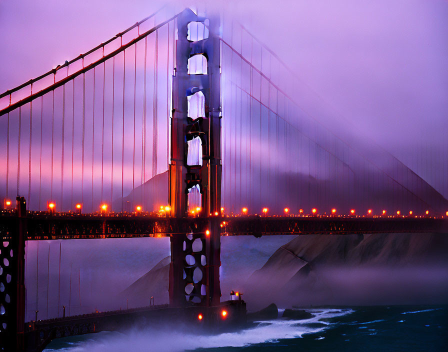 Iconic Golden Gate Bridge in mist with purple and pink sunset backdrop