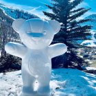 Translucent Bear Sculpture in Snowy Mountain Landscape